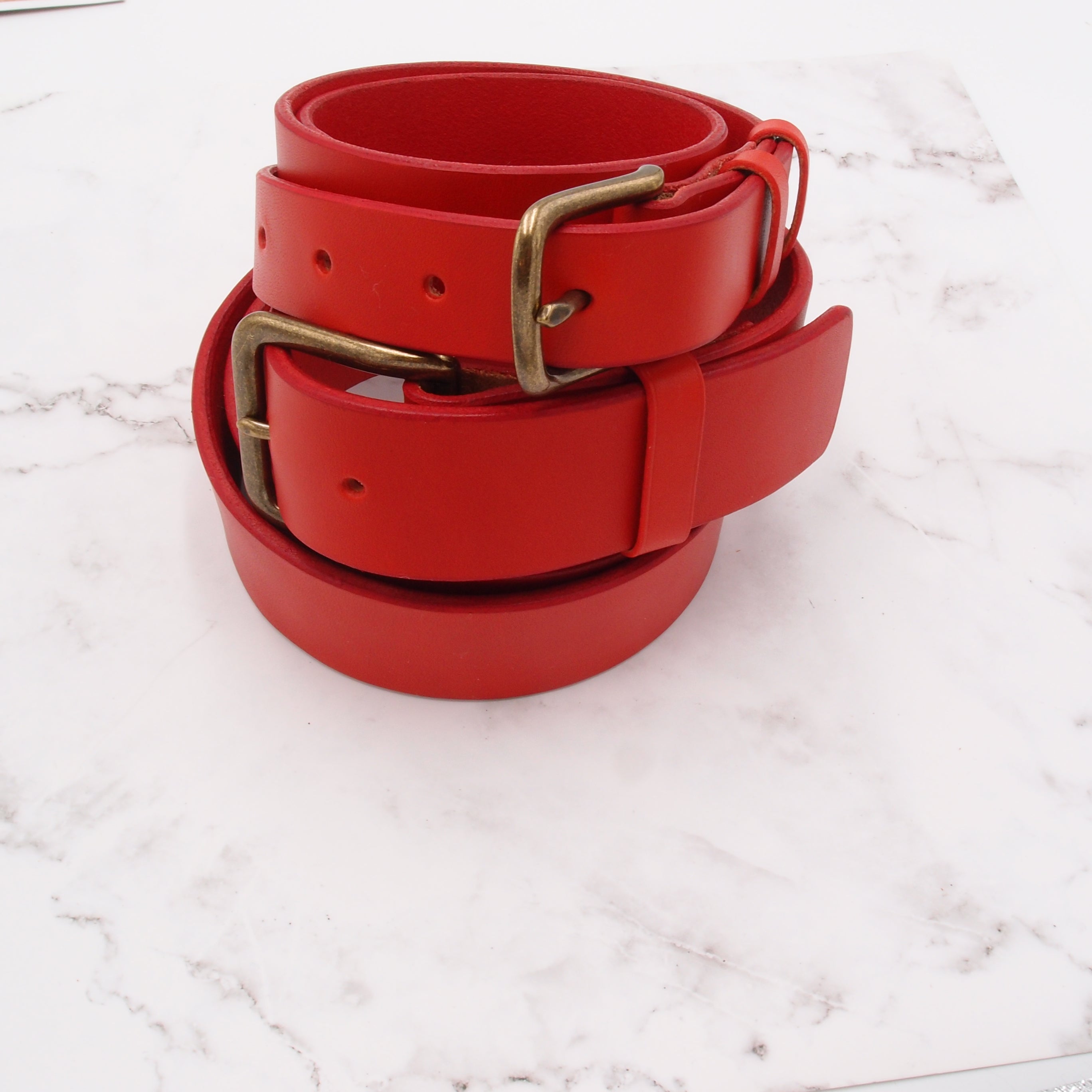 Two Red Leather Belt with Antique Brass Buckles Wrapped in Circles