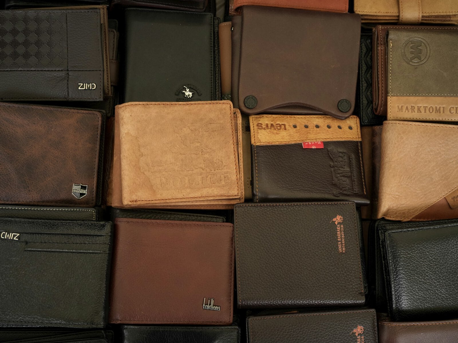 how to tell real leather from fake